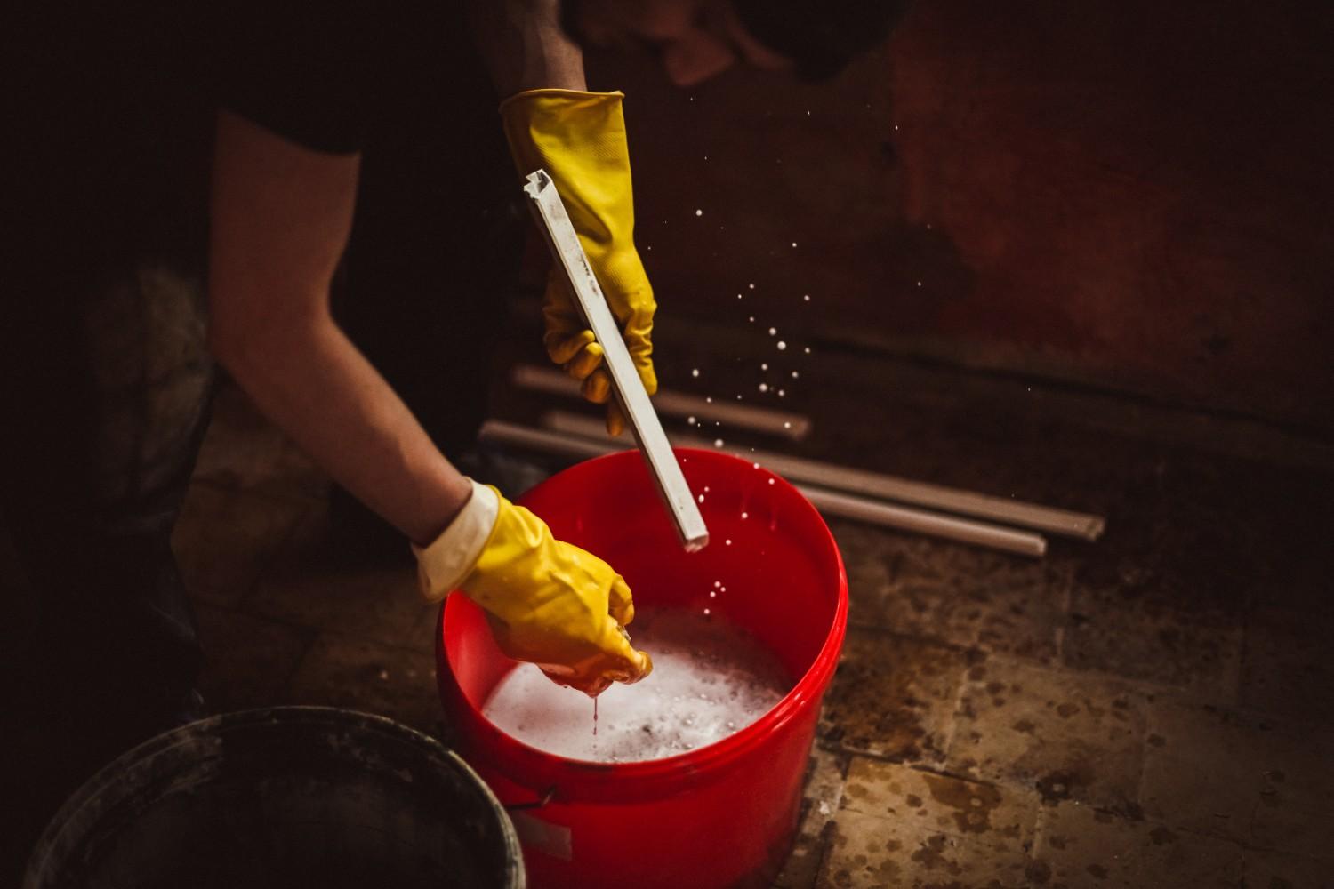 a-young-man-washes-window-frames-with-water-and-a-2026-03-19-23-14-15-utc (1)